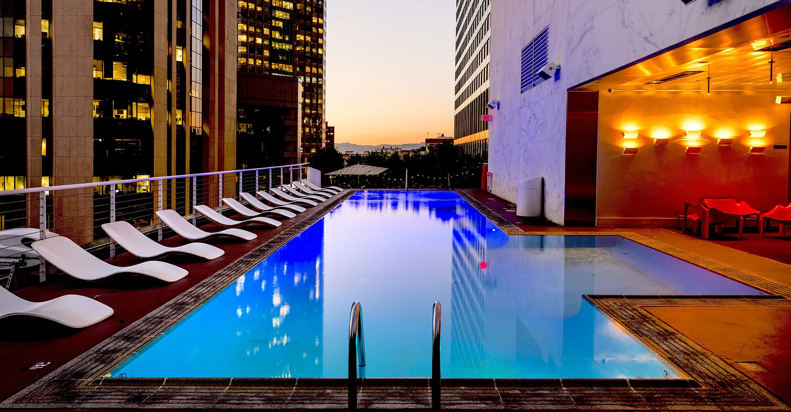 A hotel pool at sunset